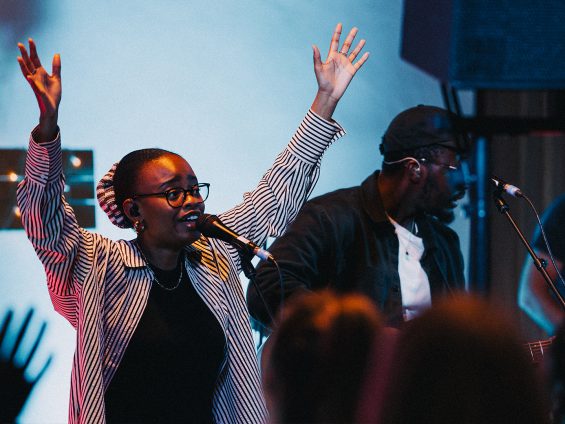 Worship Leader with hands raised
